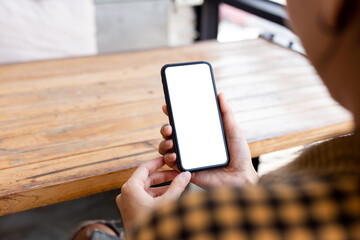 cell phone blank white screen mockup.woman hand holding texting using mobile on desk at office.background empty space for advertise.work people contact marketing business,technology