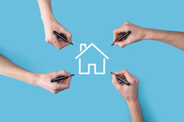 Several, four hands draw a house icon with a marker.Real estate concept.Property insurance and security concept.Innovation technology internet Network Concept.