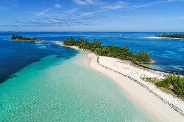 Aerial view of Munjack Cay with bay and beach in Abaco, Bahamas. Green turtles and stingrays...