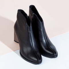 Woman shoes with long shadow on white background