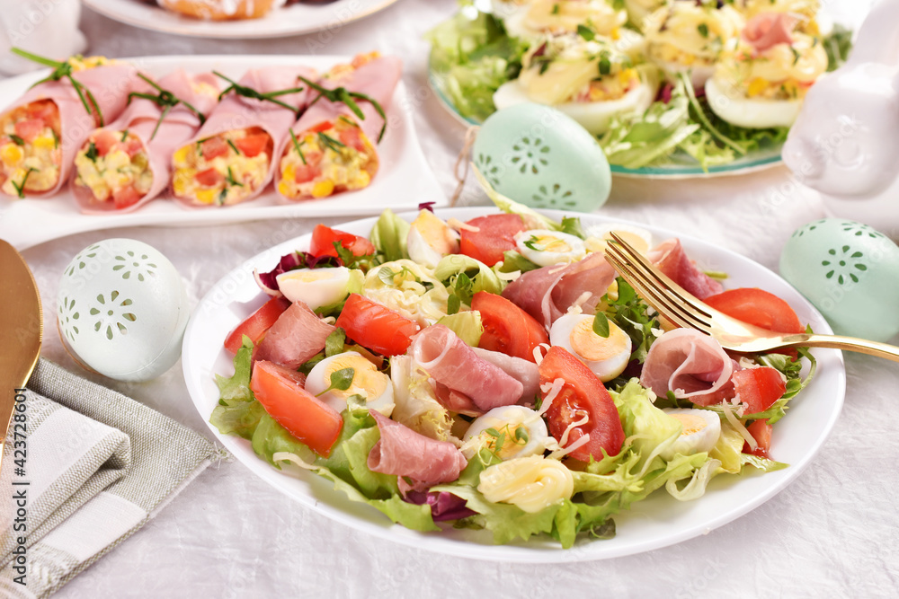 Wall mural fresh salad with quail eggs and prosciutto ham for easter breakfast