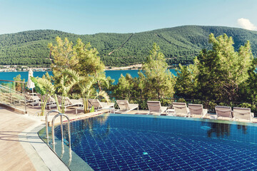 BODRUM,TURKEY : JULY 10, 2018 - Luxury Pool above the Sea with Mountain View