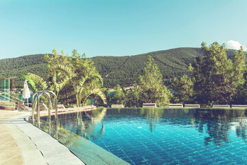 BODRUM,TURKEY : JULY 10, 2018 - Luxury Pool above the Sea with Mountain View