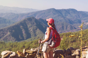 Fototapeta premium Hiker Woman with Backpack on the Top of a Mountain with Stunning View. Pirin Mountain ,Bulgaria 