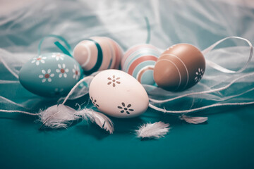 Colorful easter eggs in pastel colors with copy space.