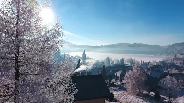 Beautiful View of Frozen Tree and Aerial View od Lake in Dedinky in Slovakia during winter time.