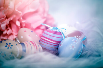 Colorful easter eggs in pastel colors with copy space.