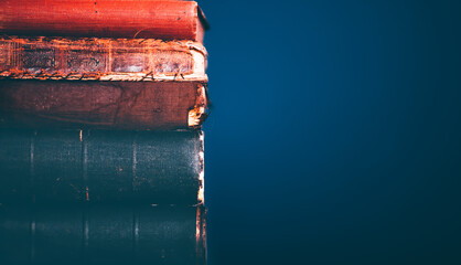 Collection of old books on dark background
