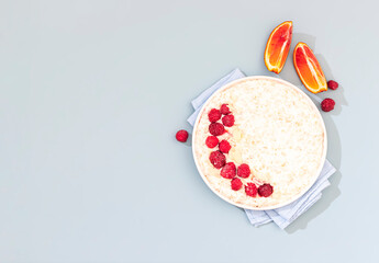 Breakfast oatmeal porridge with raspberries. Healthy breakfast concept.