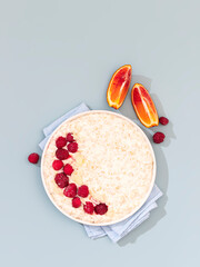 Breakfast oatmeal porridge with raspberries. Healthy breakfast concept.