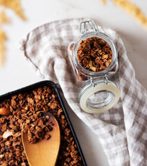 Homemade granola in a glass jar. Selective focus. Healthy food concept.