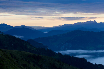 Early morning in the mountains. The sun rises over the mountains. Dawn in the mountains.