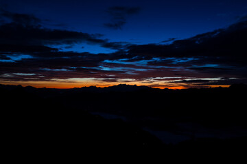 Early morning in the mountains. The sun rises over the mountains. Dawn in the mountains.