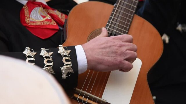 Mariachi Playing The Guitar. Mariachi Group At A Wedding Singing And Playing The Guitar