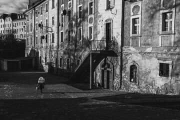 black and white photo of the old city flats at sunny day