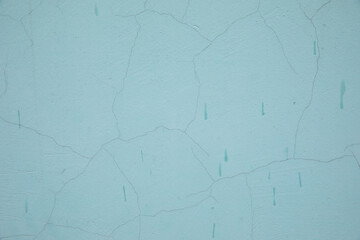 Blue background with many small cracks. Blue soft pastel background