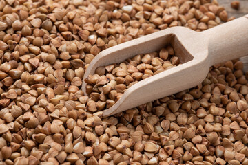 scoop on a pile of buckwheat, close-up