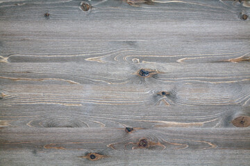 Aged wooden surface with knots and cracks