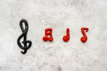 Top view of music notes made of rubber. Music abstract background