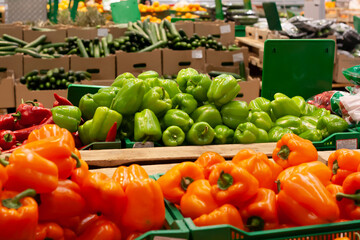 Bell peppers in the grocery store among other products