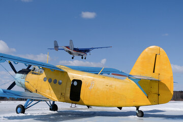 Aviation. An old biplane and modern airplane.