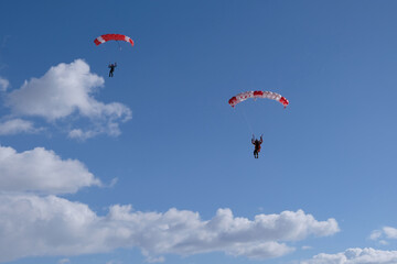 Skydiving. Two parachutes are flying in the sky.