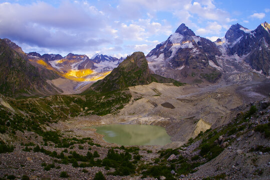 Lake Bashkara Upper on the background of the mountain ranges of the Caucasian Wall in the Elbrus region