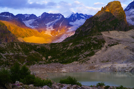 Sunset on Lake Bashkara against the background of the Caucasian Wall in the Elbrus region
