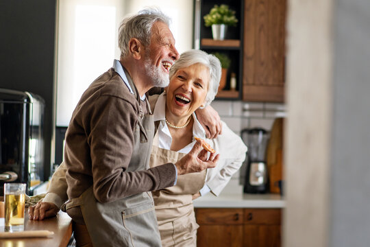 Senior happy couple in love smiling in kitchen