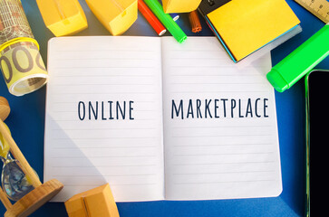 Notebook with the inscription Online marketplace. E-commerce website. Online store that allows...