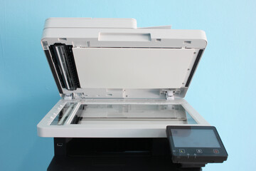 photocopier is a machine that makes paper copies of documents and other visual images ,close-up multi-function device, printer scanner, copier.