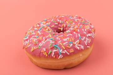Fresh made Donuts isolated on pink background. Doughnuts are traditional sweet pastries. Copy space for text.