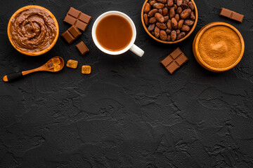 Background with assorted coffee and cocoa - beans with powder and hot drink