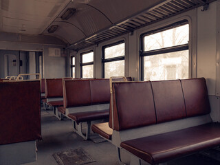 seating in an empty train car, selective focus, Train departing from station, travel during covid, author's treatment