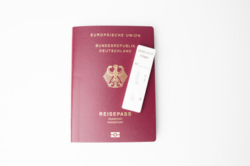 A Covid 19 antigen saliva test with a negative result is on a passport. Negative test result to be allowed to travel. Entry requirements in Germany 