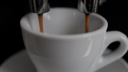 Coffee machine in detail - Espresso flows into a cup - studio photography