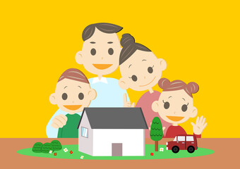 ミニチュアの家を囲む家族