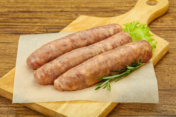 Raw pork meat sausages for grill