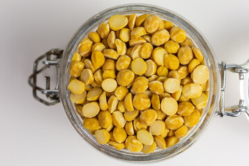 dried chana dal beans in a glass jar - 423753021