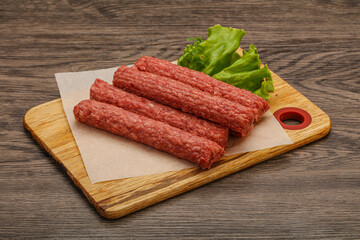 Raw beef sausages with spices