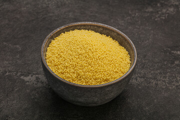 Raw cous cous heap in the bowl