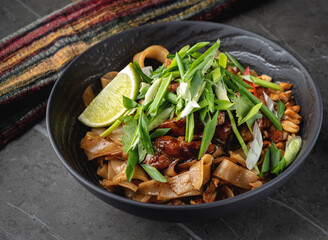 bowl of Asian noodles, meat and vegetables