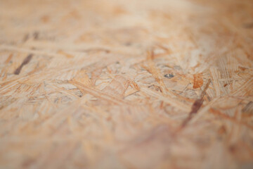 Naklejka premium Close up of brown chipboard. Chipboard background.