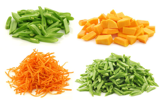 Cut string beans, butternut pumpkin and julienne cut carrots on a white background