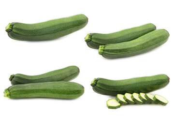 fresh zucchini's and a cut one on a white background
