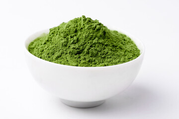 Detox Superfood Green Barley Sprout grass powder . Space for Text on white background isolated