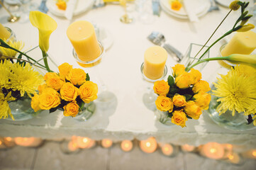 yellow flowers and candles
