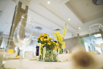 yellow roses on festive table