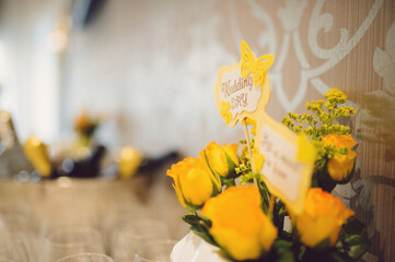 yellow roses and wedding table