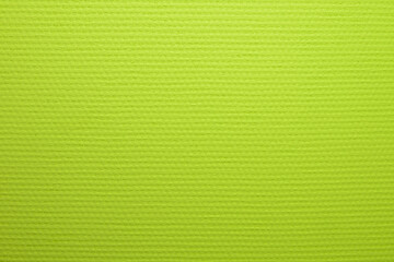 Painted in lime color wallpaper with a texture of large matting